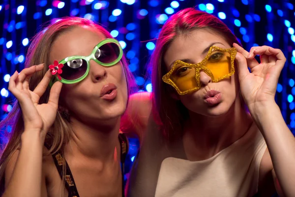 Two party girls with glasses