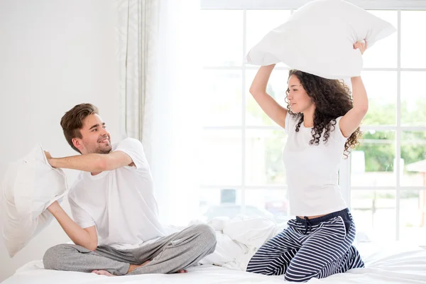 Couple pillow fighting