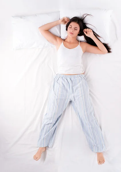 Woman sleeping in free fall position