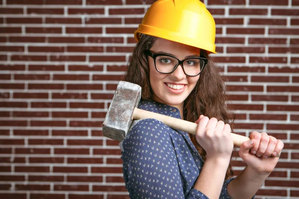 Concept for stylish young woman near brick wall