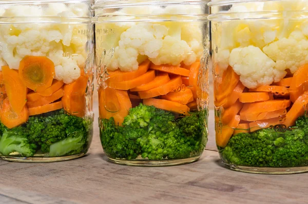 Jars of cut vegetables for canning