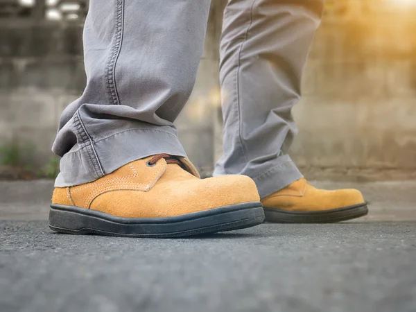 Close up of man wears safety shoes