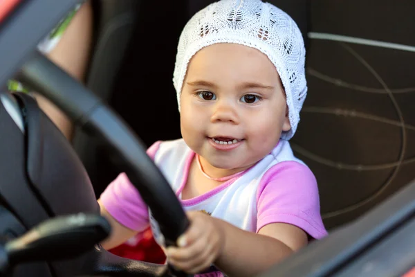 Girl at the wheel the car