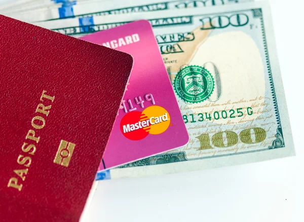 Passport, dollars bills and credit card