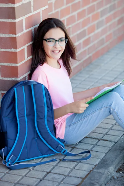Preteenager girl with backpack