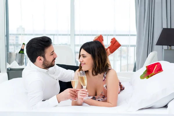 Cute couple on honeymoon in hotel.