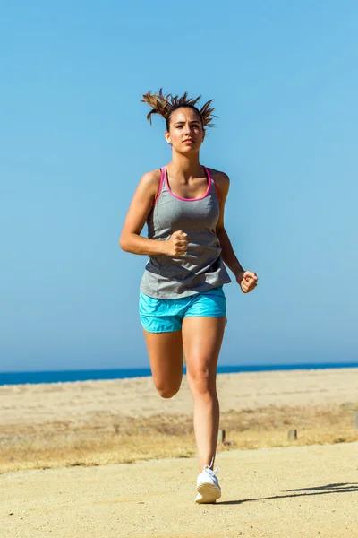 Young woman running to camera.