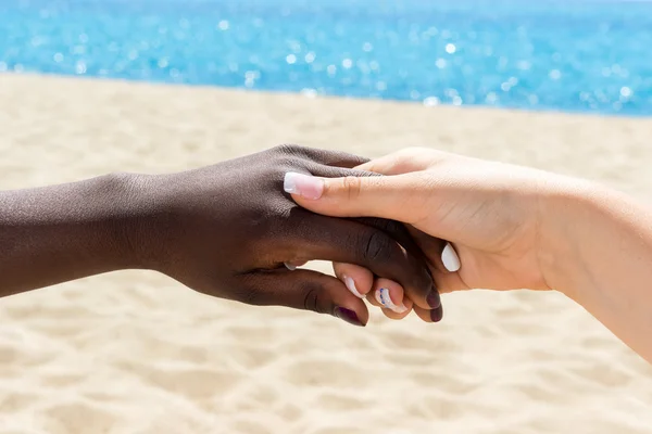 Diverse hands touching