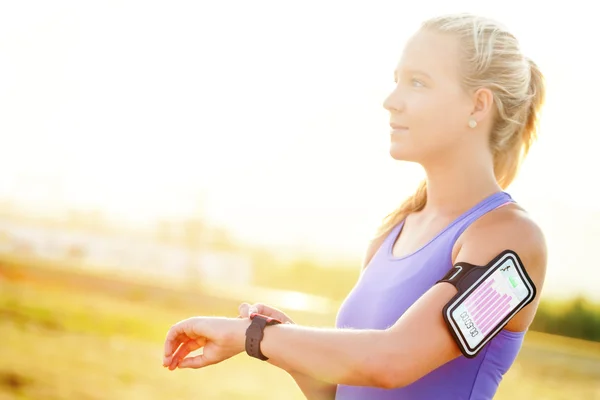 Woman setting workout on smart watch