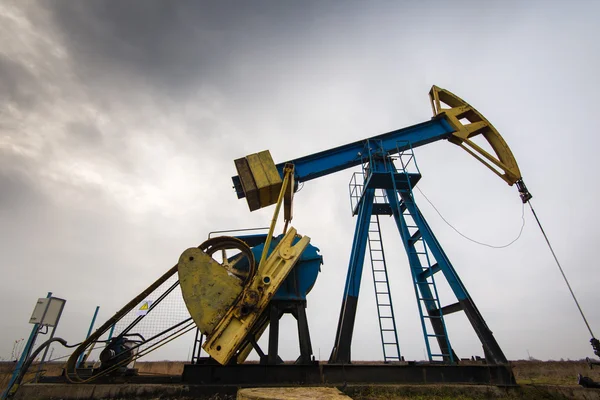 Industrial landscape with oil and gas well