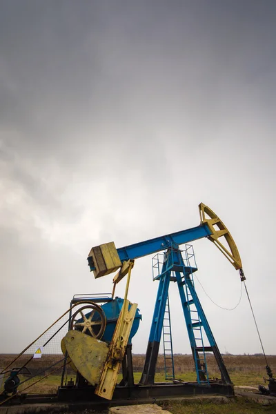 Industrial landscape with oil and gas well