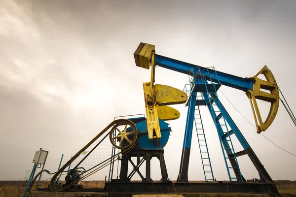 Industrial landscape with oil and gas well