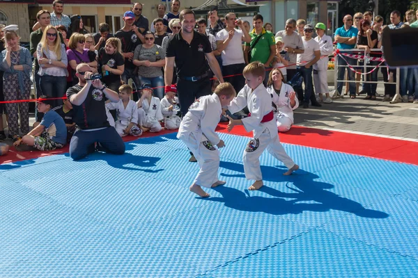 Young judo wrestlers 8-10 years on the demonstration performance