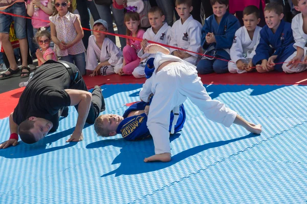 Young judo wrestlers 8-10 years on the demonstration performance