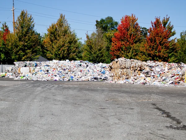 Baled and mounded recycled trash ready for transport to reuse facility
