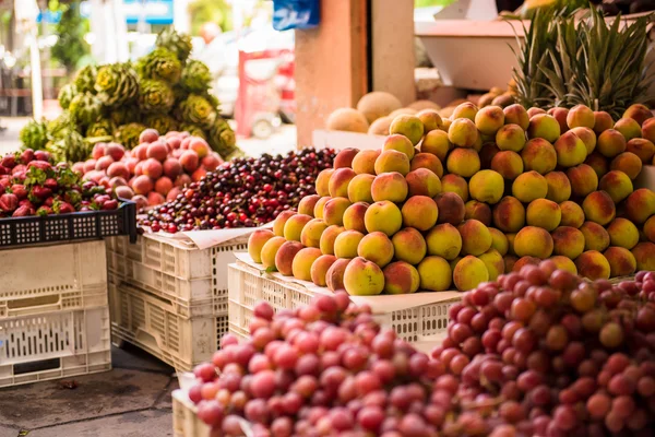 Street market with fruits and vegetables.