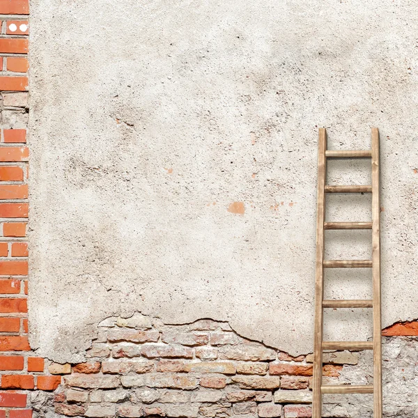 Weathered stucco wall with wooden ladder