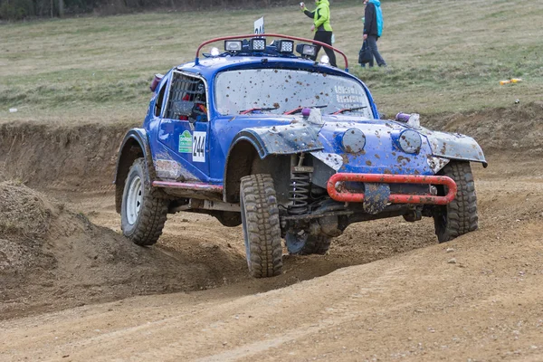 Special blue off road car is in the turn in terrain