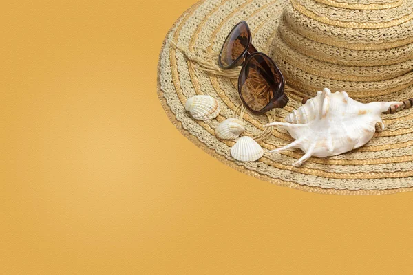 Straw hat on the yellow background