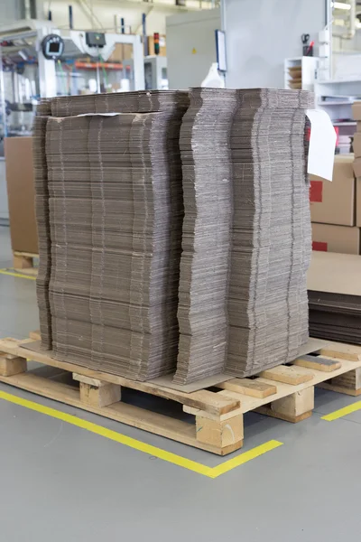 Cardboard packaging material in factory