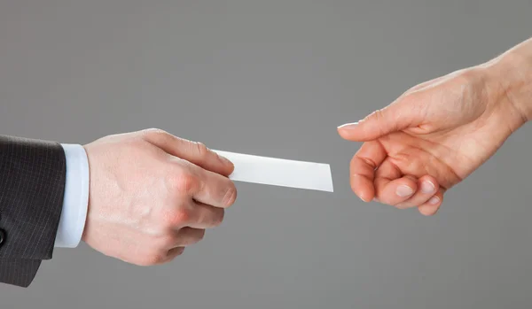 Business people exchanging blank card