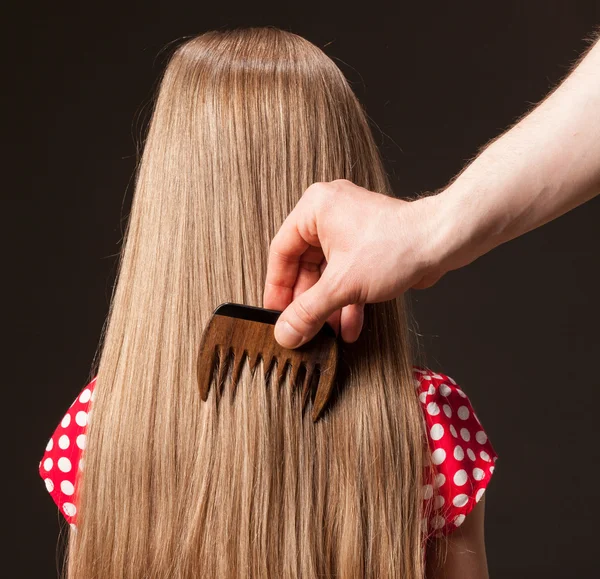 Hand combing beautiful long hair