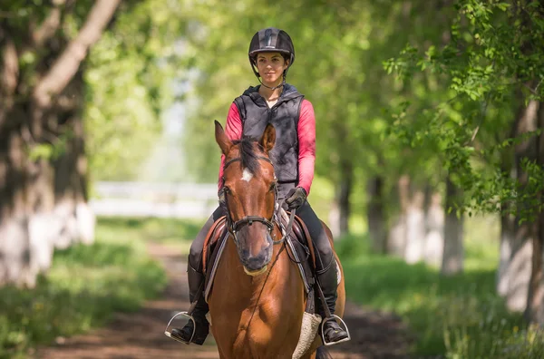 Young woman on a horse ride