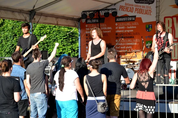 Open air concert of rock music band called \