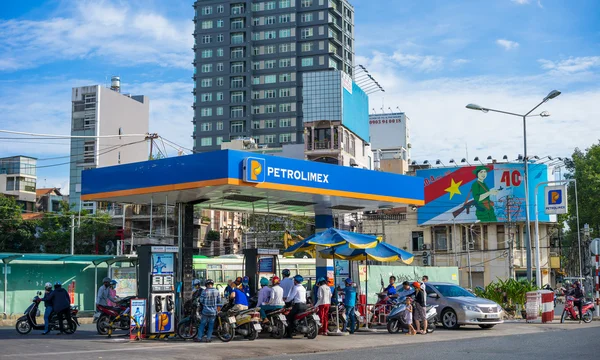 Gas Station near Passenger bus transports people in city, stop at Ben Thanh bus station