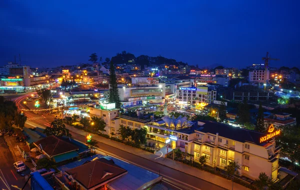 Dalat city at night from high above with hotels, da lat market and road.