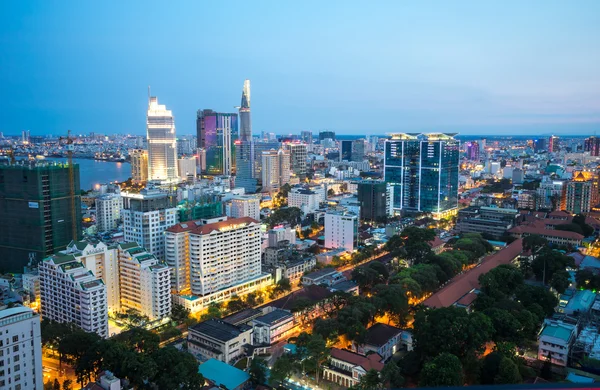 Ho Chi Minh city aeriel view 2015 with new buildings and five star hotels at colorful lights night downtown riverside