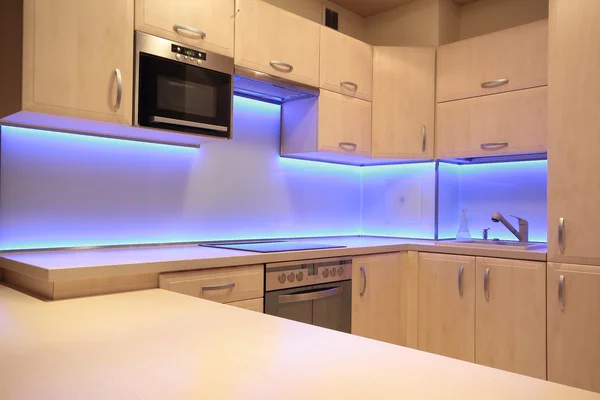 Modern luxury kitchen with purple LED lighting