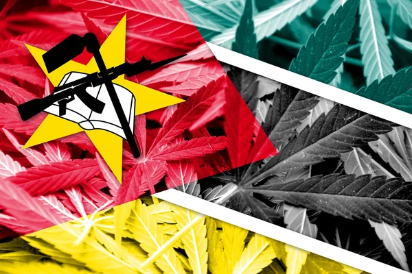 Mozambique Flag on cannabis background. Drug policy. Legalization of marijuana
