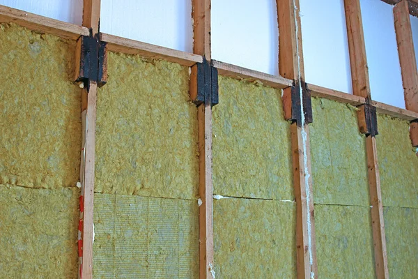 Walls of a frame house with different types of heat insulation