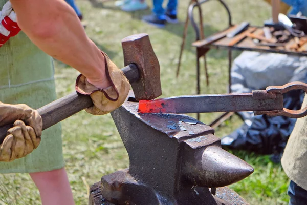 Hammer forging hot iron