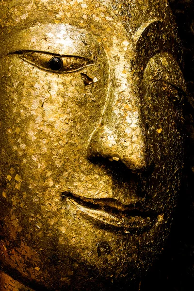 Gold face Buddha statue.
