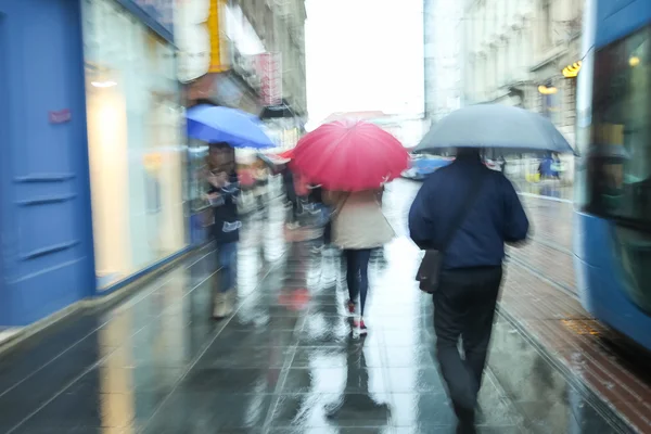 Motion of people with umbrella