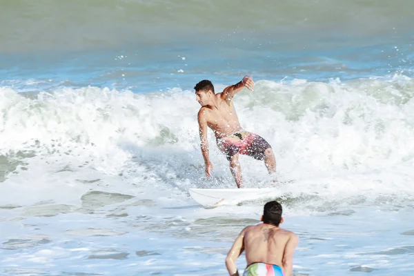 Cabedelo, Paraiba, Brazil - September 18, 2016 - Young man surfs in Intermares Beach
