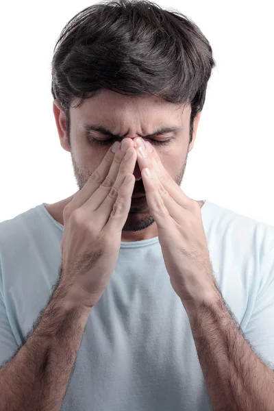 Sinus pain, sinus pressure, sinusitis. Sad man holding his nose