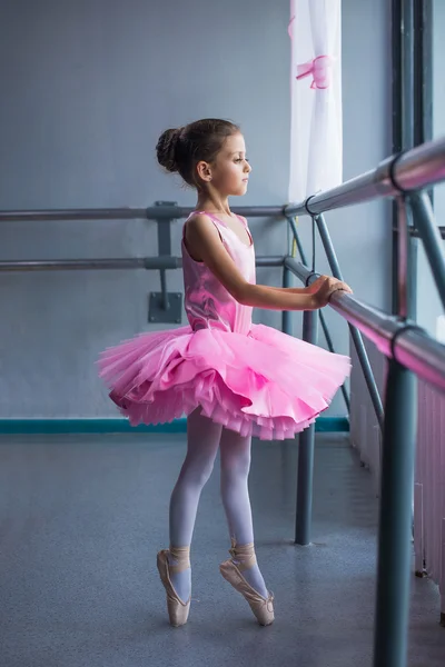 Cute little ballet dancer at training class