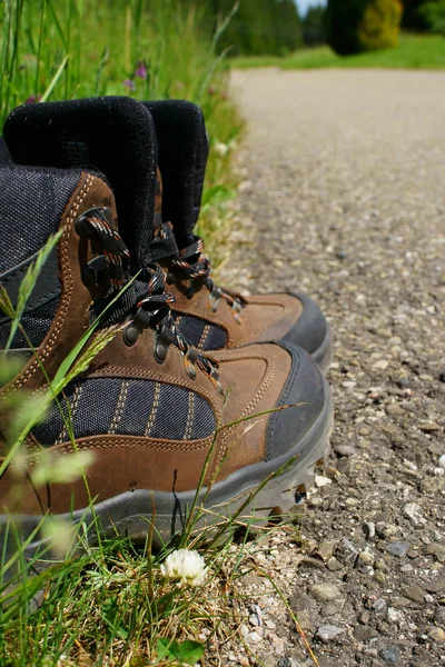 Close-up of Hiking boots on the roadside