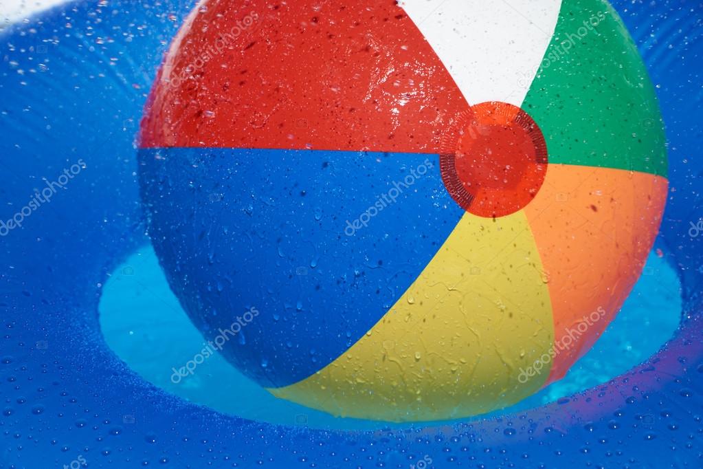 Pool Water With Beach Ball floating tire and beach ball in the pool — stock photo Pool Water With Beach Ball floating tire and beach ball in the pool — stock photo