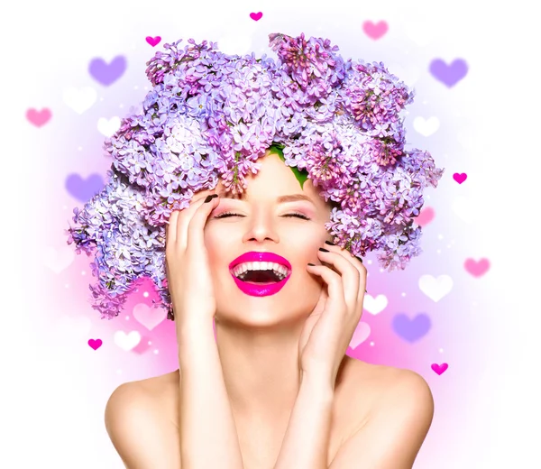 Girl with lilac flowers hairstyle