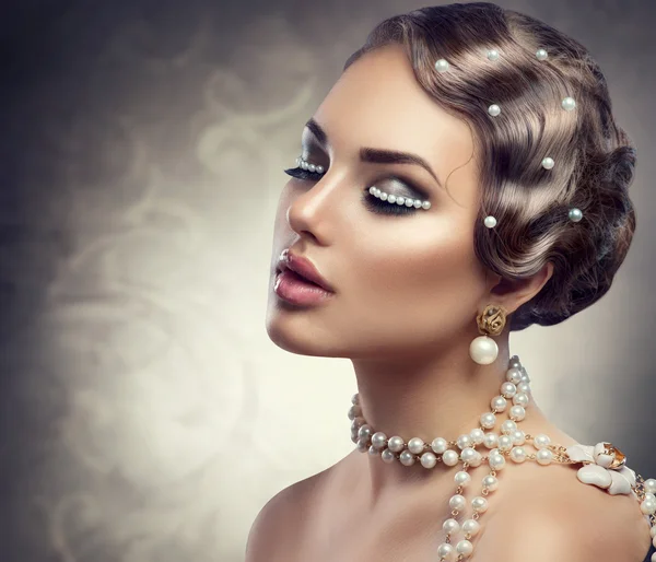 Retro styled makeup with pearls.