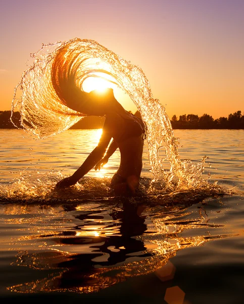 Girl splashing water with hair
