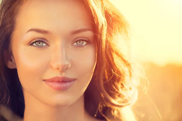 Teenage girl smiling in sun light