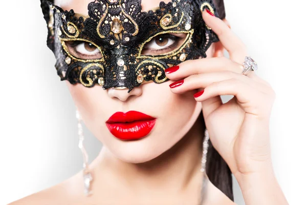 Woman wearing masquerade carnival mask