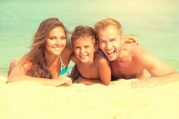 Happy family having fun at  beach.