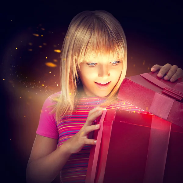 Surprised child with gift box.