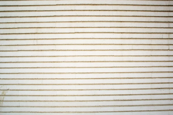 Stone white pavement with horizontal stripes as a background, to